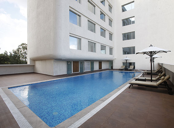 hotel with pool in mahadevpura